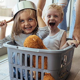Kids in laundry basket